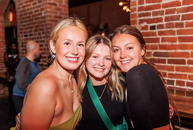 Three women smiling