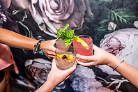 Three cocktails cheersing